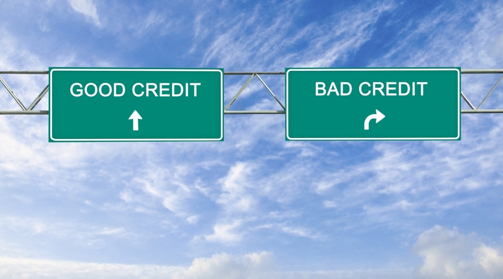 Two green overhead highway direction signs reading good credit and bad credit to follow the fix your credit theme of the article.