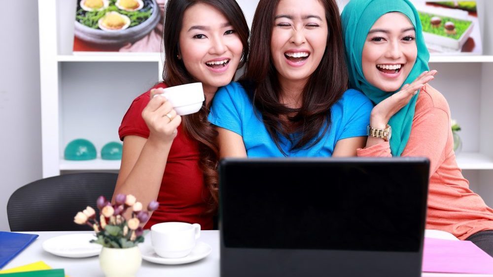 Photo of three ladies that shows the idea of renting to college students.