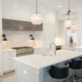 All white and glass front cabinetry captures the newest kitchen trends.