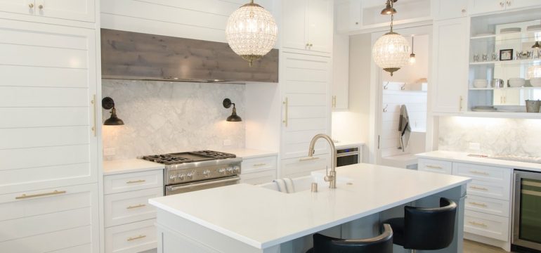 All white and glass front cabinetry captures the newest kitchen trends.