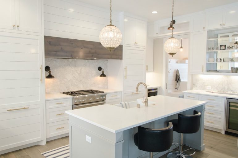 All white and glass front cabinetry captures the newest kitchen trends.