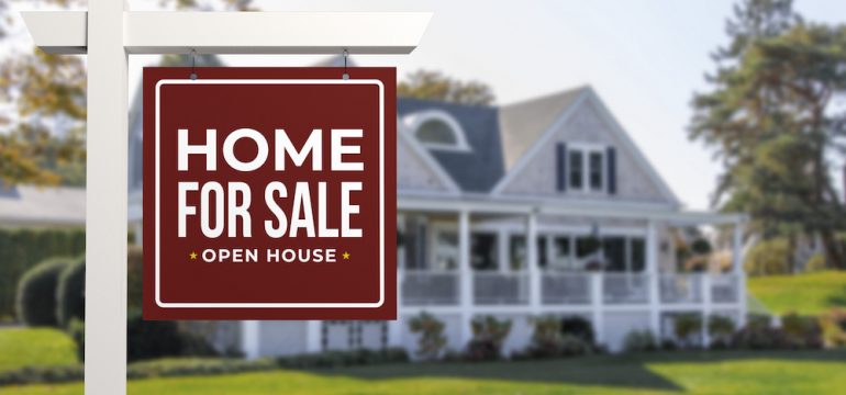 Home For Sale and Open House Real Estate Sign in front of a typical American style house.