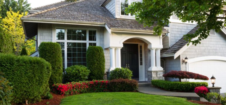 Beautiful home exterior during late spring season with clean landscape making first impressions.