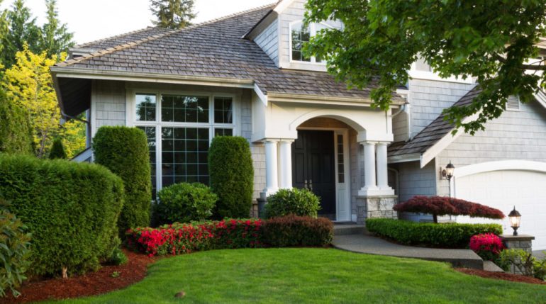 Beautiful home exterior during late spring season with clean landscape making first impressions.