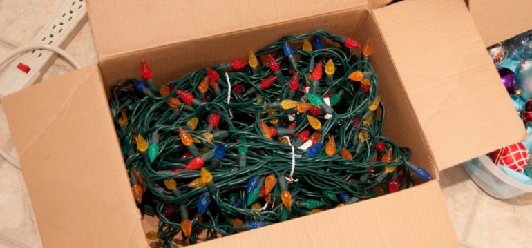 Christmas tree lights in box ready to be checked for Winter To-Do's list.