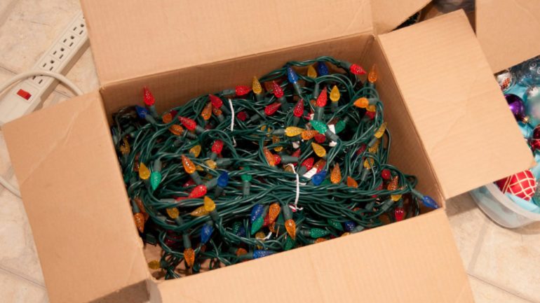 Christmas tree lights in box ready to be checked for Winter To-Do's list.