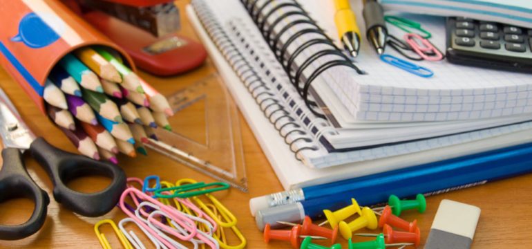 Photo of colorful school supplies on the August Shopper Guide list.