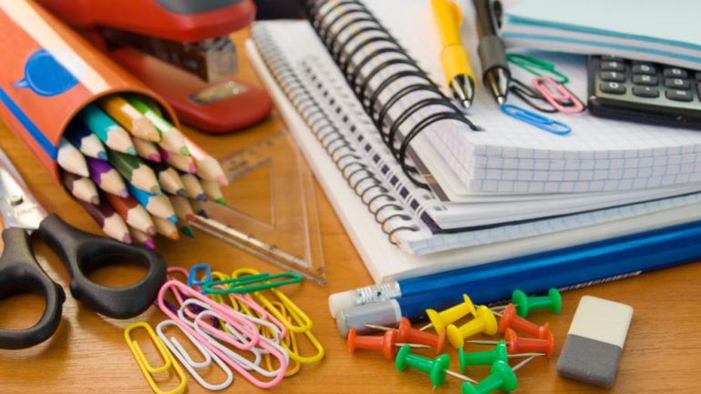 Photo of colorful school supplies on the August Shopper Guide list.