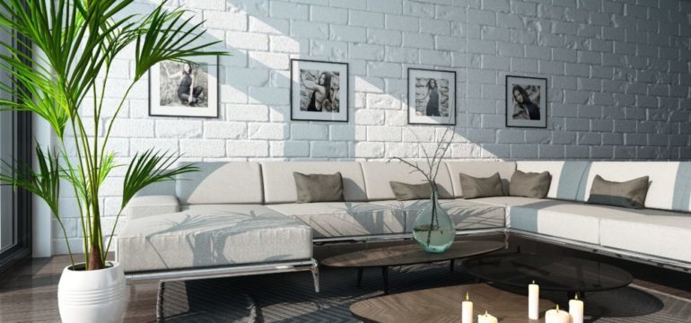 Nice living room interior with couch and painted brick wall.