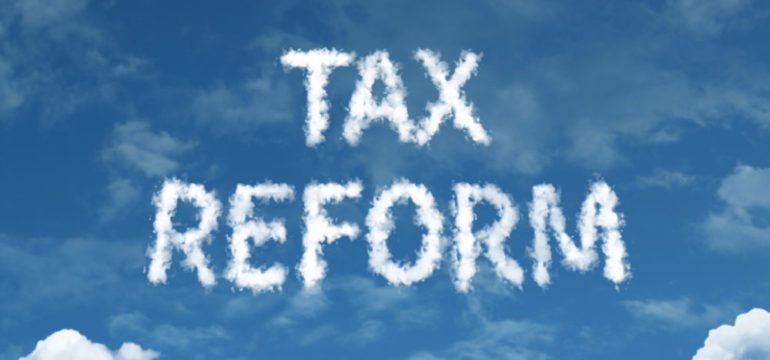 Tax law reform cloud word on top of a blue sky.