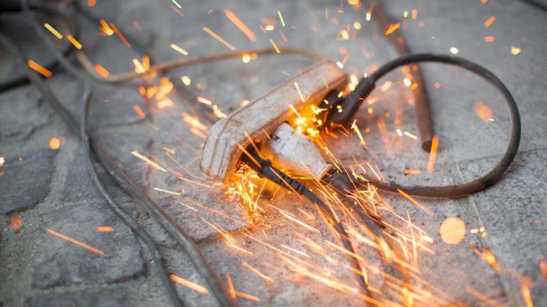 Burning electrical wire showing the dangers of electricity around the home.