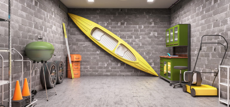 Interior of garage with sports gear organized against the walls.