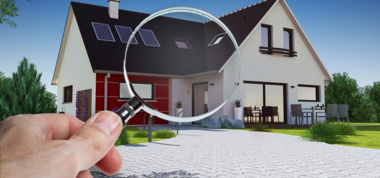 Concept of a home inspection specialist closely examining an entire house.