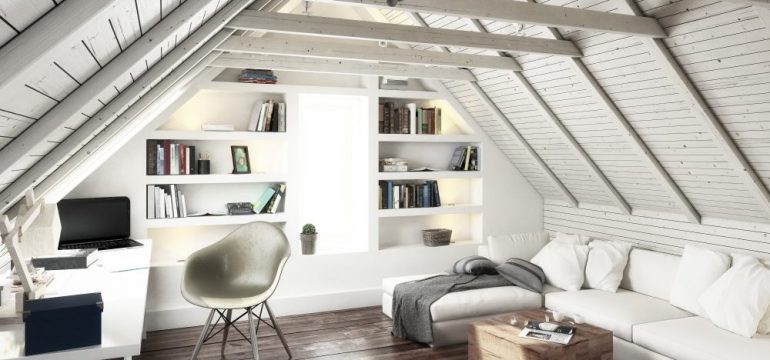 Attic conversion to a bright living space with white decor.