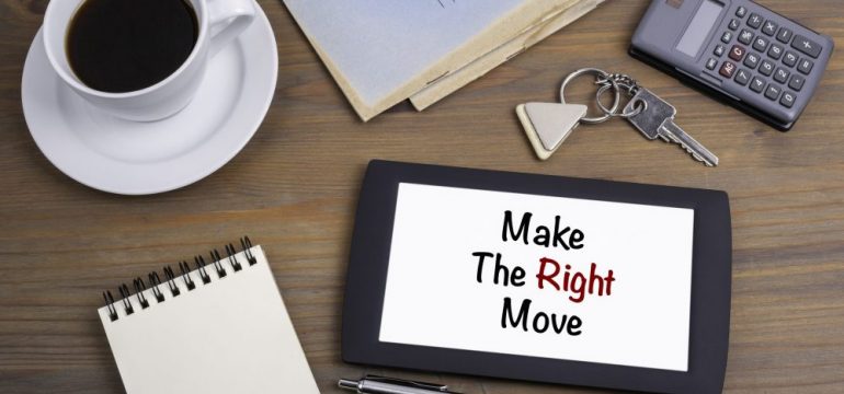 "Make the Right Move" text on tablet device on a wooden table provides advice to someone that is relocating.