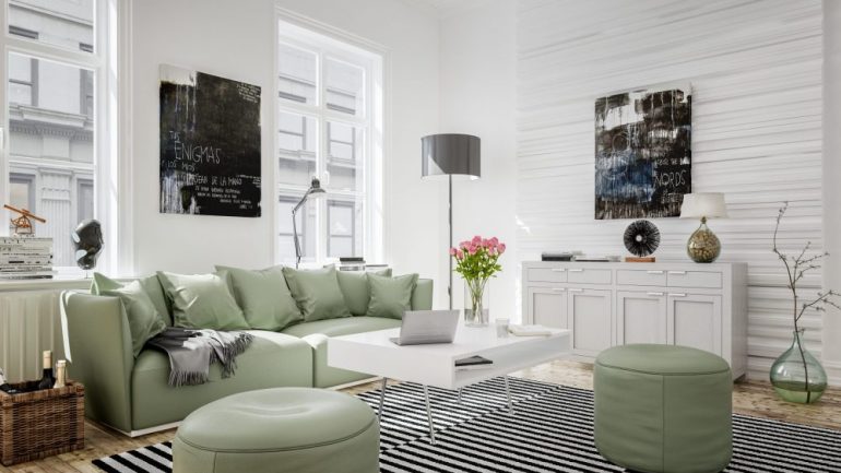 Bright apartment with grass green and white furniture that shows landlords how attractive a space can be if you decide to furnish your rental property.