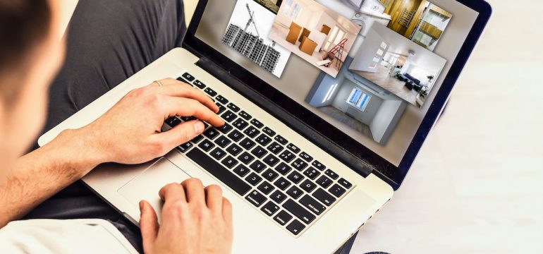 Gentleman conducting a home search online on a laptop during the coronavirus pandemic.