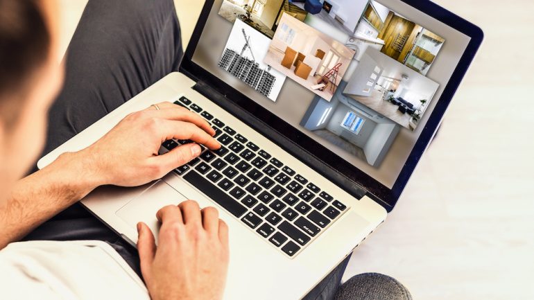 Gentleman conducting a home search online on a laptop during the coronavirus pandemic.