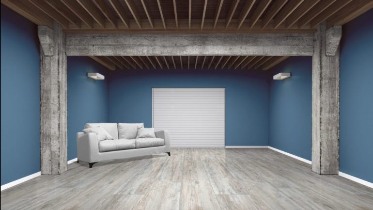 Empty garage with sofa on white background. An illustration of residential garage conversions to livable space.