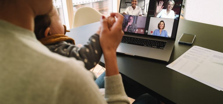 Group of business people smart working from home. Woman at home talking to her colleagues via video conferencing.