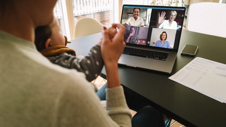 Group of business people smart working from home. Woman at home talking to her colleagues via video conferencing.