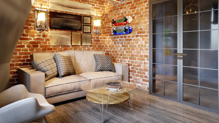 Urban contemporary loft living room. Interior design on with gray and red brick wall.