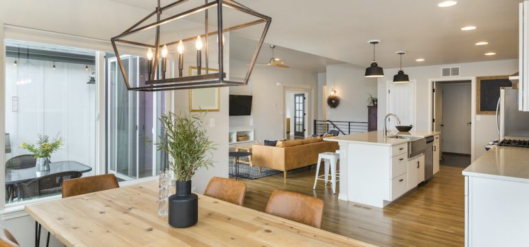 Modern farmhouse design dining area open to kitchen.