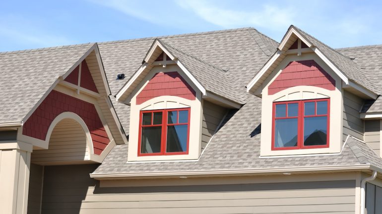 Gable dormers and roof of residential home.