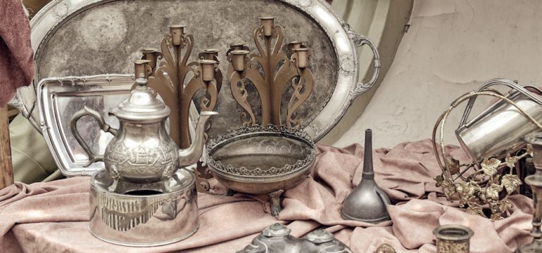 Brass containers and plates, candle holders and other old vintage copper cookware found at estate sales.
