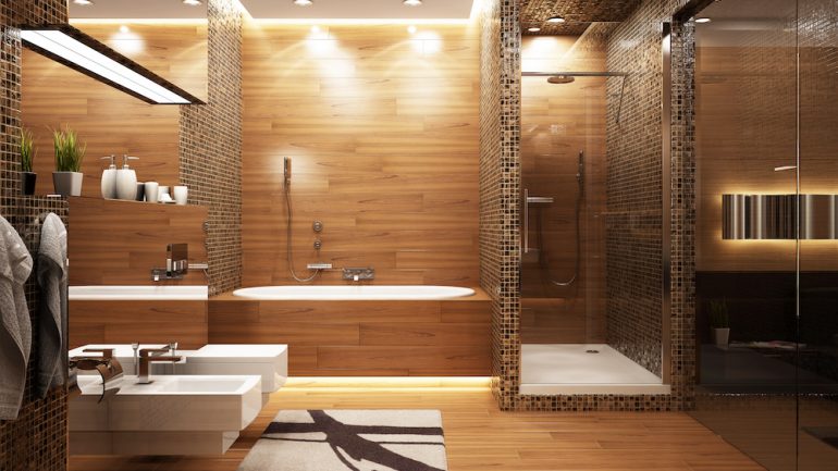 Bathroom lighting shown in various areas of a modern bath including shower, tub, sink and toilet area.