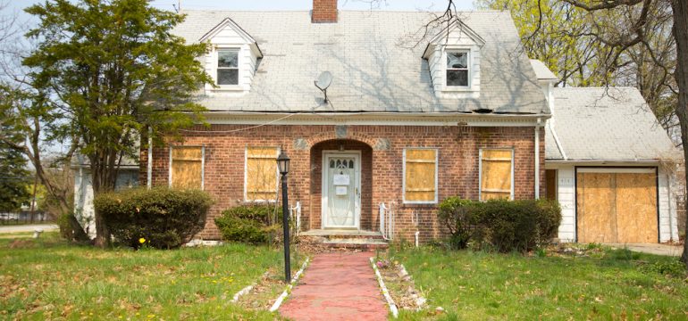 A rundown home that will be a problem for a neighbor if they list their home for sale.