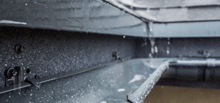 Jets of rain drain into the drainage system on the roof of the house. Homeowners need to protect their homes against mother nature's wrath.