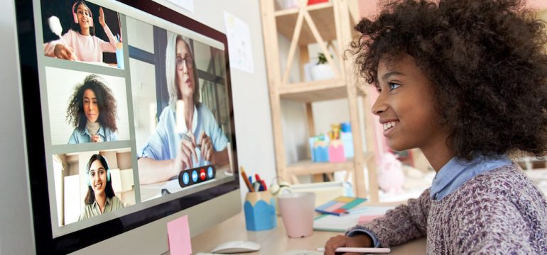 Young girl distance learning during virtual online class showing home designs that have adapted since the pandemic.