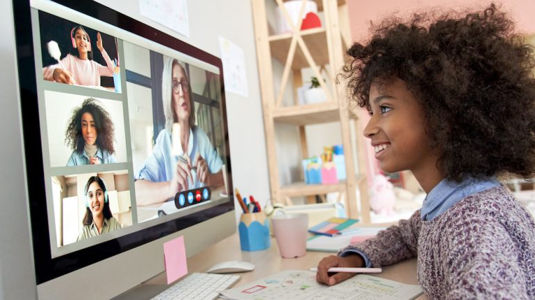 Young girl distance learning during virtual online class showing home designs that have adapted since the pandemic.