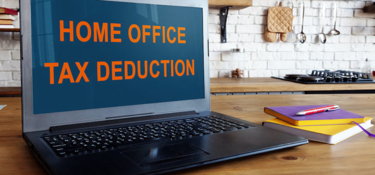 Home office tax deduction information on laptop screen.