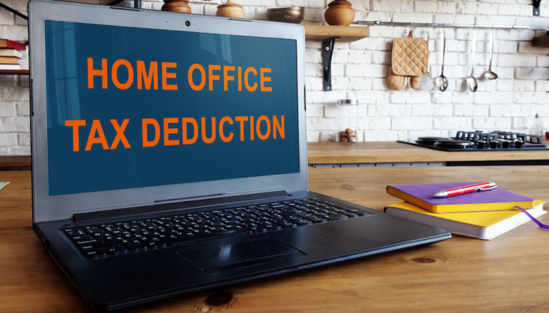 Home office tax deduction information on laptop screen.