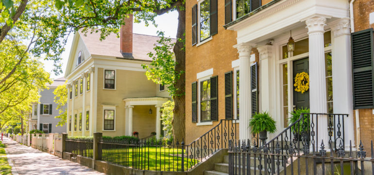 Historic homes in New England along a street in Salem, Massachusetts. Showing concept of researching a home's history.