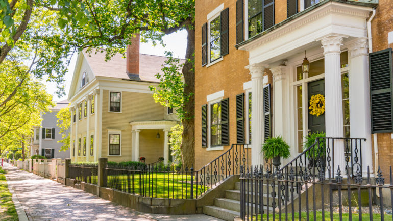 Historic homes in New England along a street in Salem, Massachusetts. Showing concept of researching a home's history.