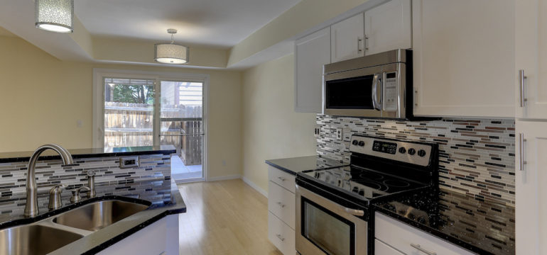 Empty kitchen of a vacant home that is for sale.