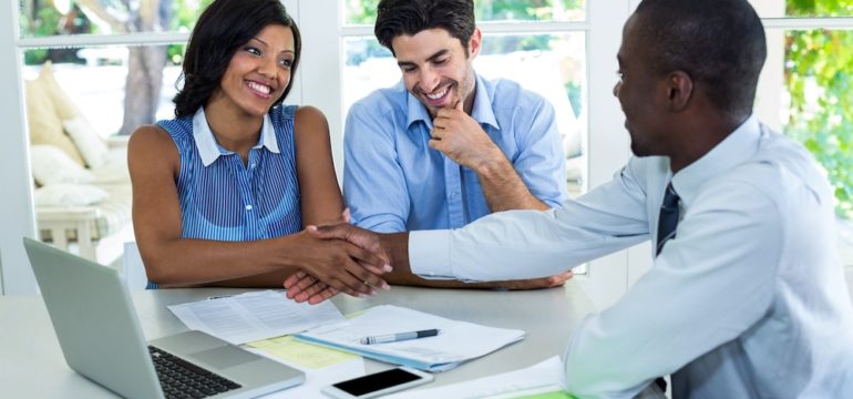 Happy couple that recognize the value of a real estate agent