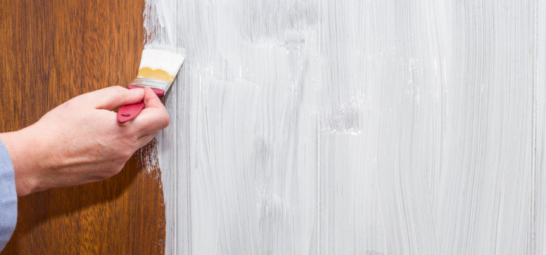 Using paint to refresh a wood paneling wall.
