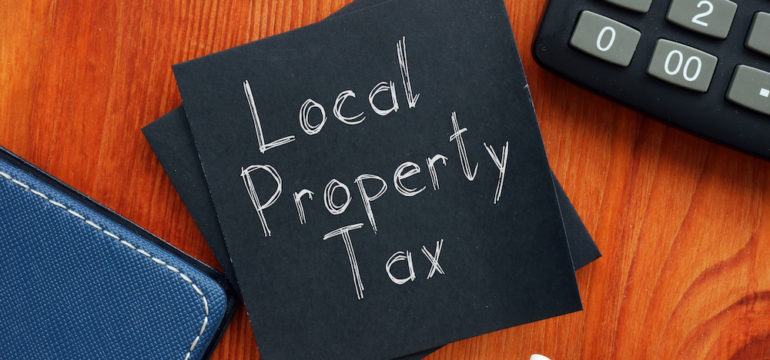Local property taxes are shown on a business photo.