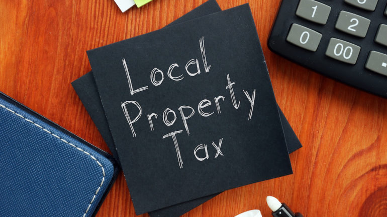 Local property taxes are shown on a business photo.