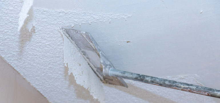 Home ceiling drywall demolition of popcorn ceiling.