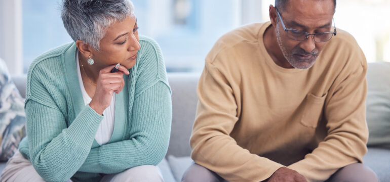 Senior couple reviewing life insurance documents.