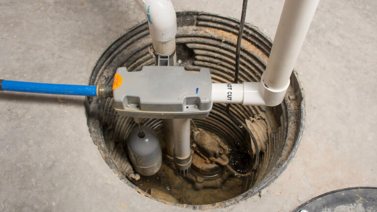 A sump pump was installed in the basement of a home with a water-powered backup system.