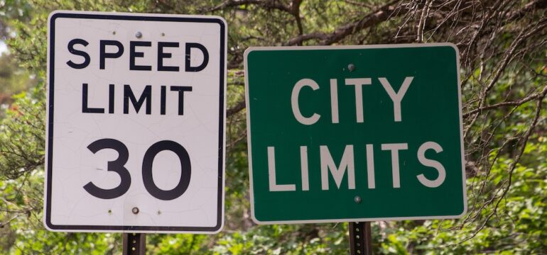 Street sign indicating city limits that is related to understanding extra-territorial jurisdiction.